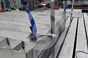 Manufacture of stainless steel products, fixation of elements with the help of F-shaped clamps, welding works