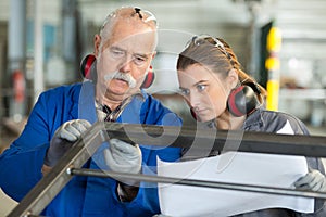 Manufacture workers working on electronic machine photo