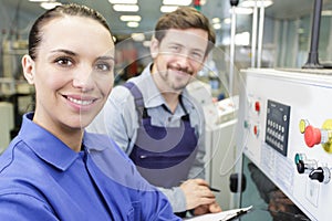 manufacture workers working on electronic machine