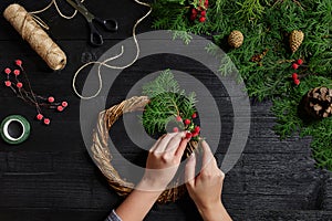 Manufacturer of Christmas decor with their own hands. Christmas wreath for the holiday. The new year celebration. Top