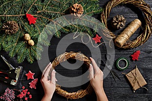 Manufacturer of Christmas decor with their own hands. Christmas wreath for the holiday. The new year celebration. Top