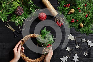 Manufacturer of Christmas decor with their own hands. Christmas wreath for the holiday. The new year celebration. Top