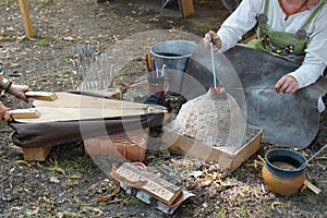 Manufacturing of glass jewelry on medieval market