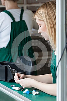 Manufacturing labourer working on assembly line