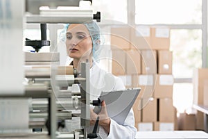 Manufacturing supervisor looking worried during quality control photo