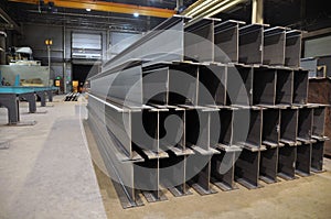 Manufacturing of a welded I-beam on an automatic welding line. Products of the plant for the production of metal structures