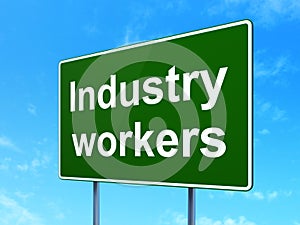 Manufacuring concept: Industry Workers on road sign background