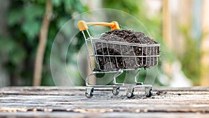 Manure on mini shopping cart