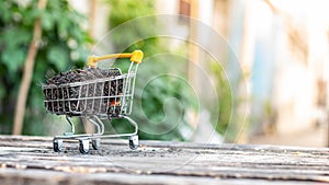 Manure on mini shopping cart