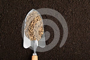 manure in planting spoon