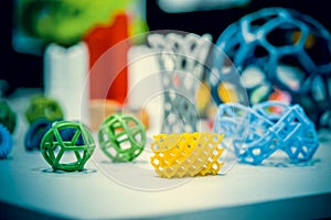 Many abstract models printed by 3d printer close-up. photo