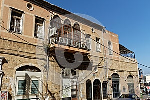 Many air conditioners on a balcony with blue sky. Old Jaffa, Tel Aviv, Israel. Aircos for cooling on a warm city day