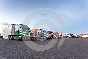 Many American trucks on parking lot.