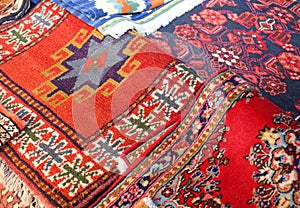 many ancient colored wool carpets made by hand in the Middle East