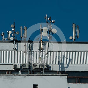 Many antennas on city building. Antennes GSM 3G CDMA UMTS.