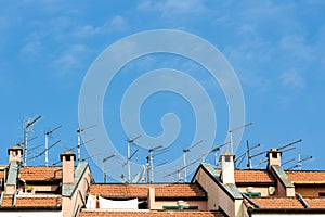 Many antennas installed on the roof of a building