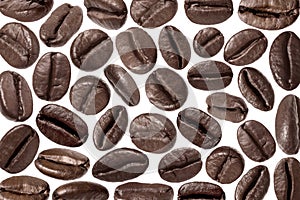 Many aromatic roasted coffee beans isolated on white