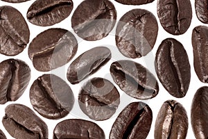 Many aromatic roasted coffee beans isolated on white