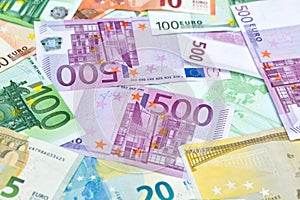 Many assorted Euro banknotes laying on a table, money background