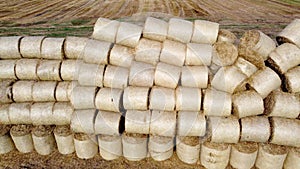 Many bales straw field Many bales rolls of wheat straw stacked together field