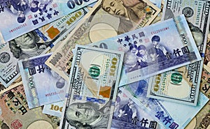Many banknotes of different countries photo