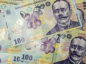 Many banknotes of one hundred romanian currency leu ron concept photo