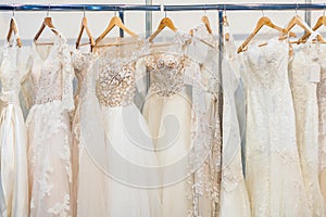 Many beautiful wedding dresses photo