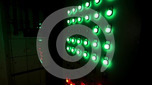 Many big red and green buttons on the industrial board at the factory. Stock footage. Industrial machine`s control panel
