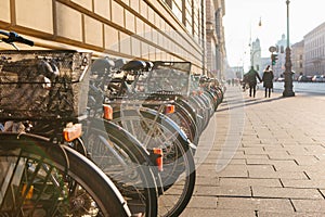 Many bikes in a row on the street in Munich, Germany, Europe. Bicycle parking. Environmentally friendly and healthy