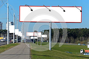 Many blank billboards on the highway