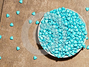 many blue candies in the shape of hearts