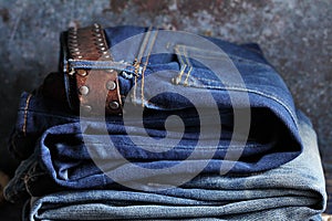 Many blue jeans in a store