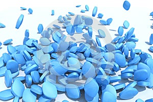 Many blue pills fall on white background