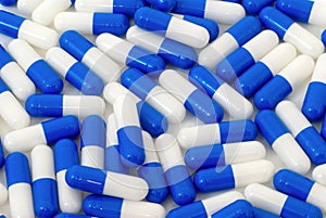 Many blue and white pills capsules background