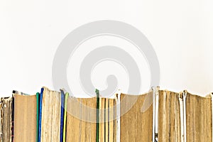 Many books standing in a row isolated