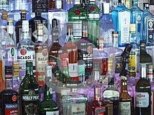 Many bottles of alcoholic liquor in a bar