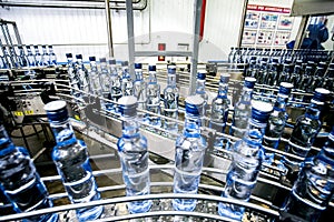 Many bottles on conveyor belt