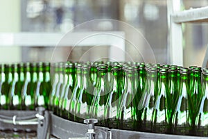 Many bottles on conveyor belt