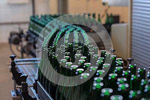 Many bottles on conveyor belt