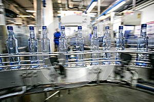 Many bottles on conveyor belt