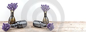 Many bouguet of violet purple lavendula lavender flowers herbs in old brown vases pharmacy bottle, on white background and