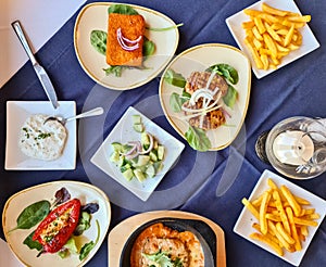 Many bowls with food on a table - Greek buffet in a restaurant