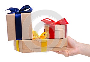 Many boxes with ribbon gift in hand