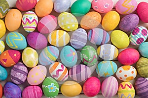 Many Bright and Colorful Easter Eggs Filling the Background. They are hand-painted or dyed.