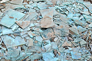 Many broken glass pieces on the ground