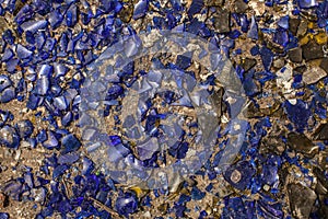 Many broken pieces of glass in blue