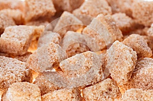 Many brown lump cane sugar cubes