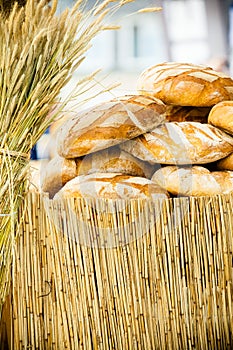 Many brown rustic fresh rye bread loaves