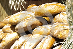 Many brown rustic fresh rye bread loaves