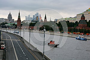 Many buildings of the Moscow business center, from the bottom to the top, diced green stand under a white sky